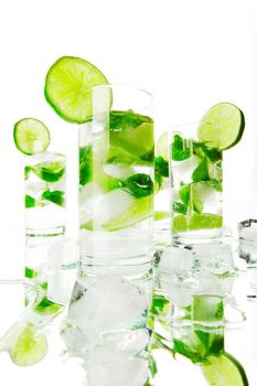 Mojito cocktails with lime and mint isolated on white background
