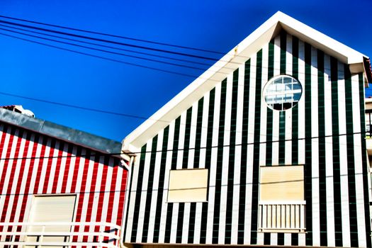 Beautiful and colorful striped facades in Costa Nova beach in Aveiro, Porto, Portugal.