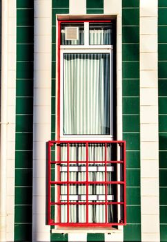 Beautiful and colorful striped facades in Costa Nova beach in Aveiro, Porto, Portugal.