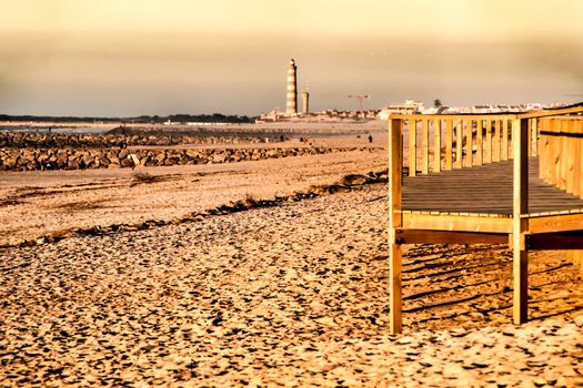Beautiful beach with dunes and wooden walkway in Aveiro, Porto, Portugal