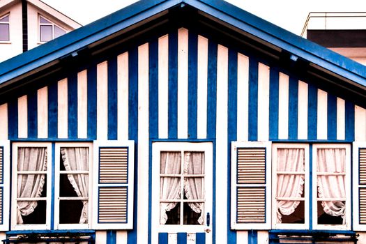 Beautiful and colorful striped facades in Costa Nova beach in Aveiro, Porto, Portugal.