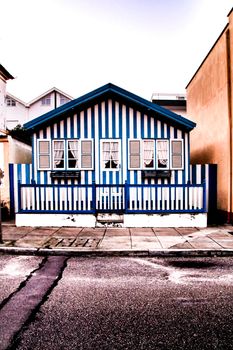 Beautiful and colorful striped facades in Costa Nova beach in Aveiro, Porto, Portugal.