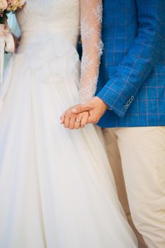 Bride and groom holding hands. Wedding in Montenegro