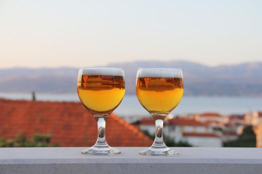 Two glasses of beer summer evening vacation relax concept