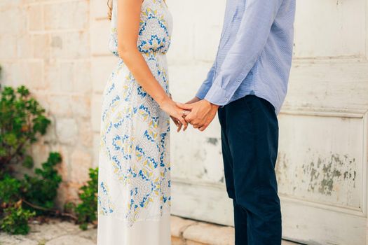 Bride and groom holding hands. Wedding in Montenegro