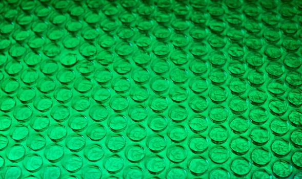 Close-up of a green bubble wrap in square