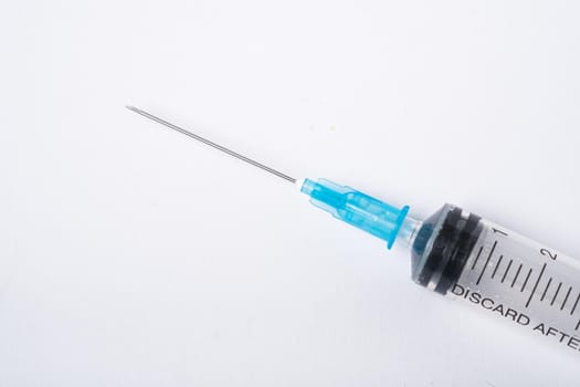 Dirty used plastic syringe, isolated