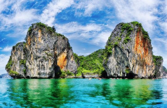 Phang Nga Bay is a 400 km² bay in the Strait of Malacca between the island of Phuket and the mainland of the Malay peninsula of southern Thailand.