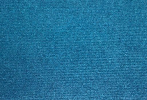 A dense industrial sheet of grey paper with a textured surface