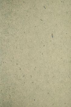 A dense industrial sheet of grey paper with a textured surface