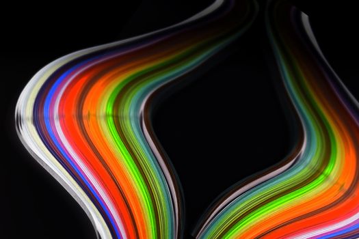 Abstract color wave curl rainbow strip paper on black background