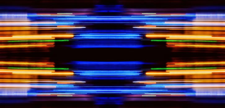 Abstract Rainbow light trails on the dark background