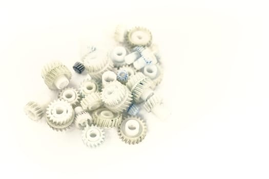 Dirty plastic gears on white background