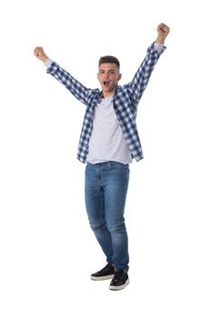 Full length portrait of a young man with arms raised isolated on a white background