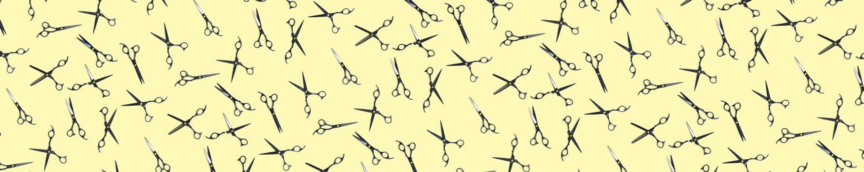 Background of black scissors. professional hairdresser black scissors isolated on yellow. Black barber scissors, close up. pop art background, for prints or posters. not seamless pattern