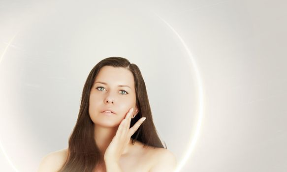 Suntan skin tone and beauty routine. Beautiful brunette female model with natural tan, face portrait of young woman.