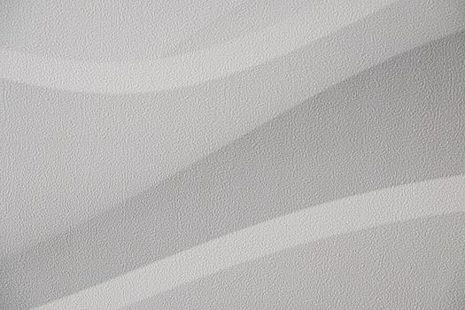 Modern wall wallpaper texture for background. Home decoration, abstraction, structure of waves or hills, gray and white.