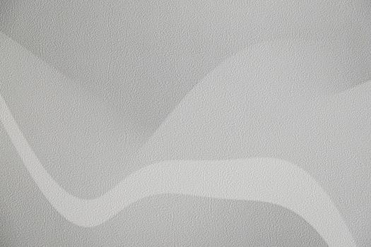 Modern wall wallpaper texture for background. Home decoration, abstraction, structure of waves or hills, gray and white.