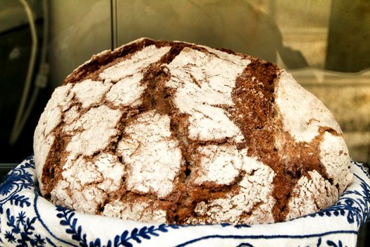 Tasty loaf of bread in a bakery showcase in Spain