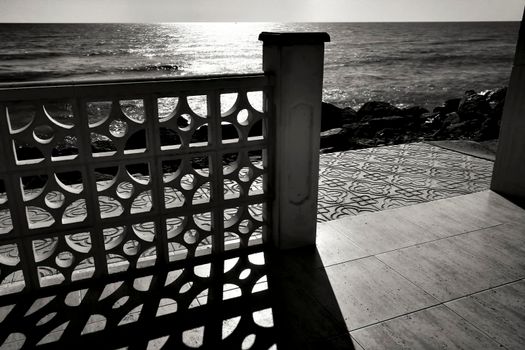 Architectural details of white typical spanish houses on the shore in Alicante, Spain. Monochrome picture.