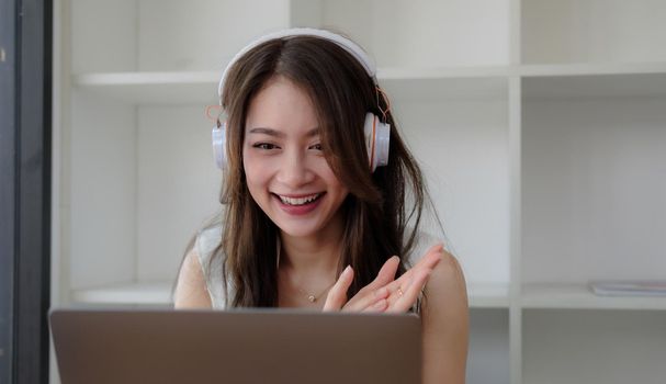 Shot of smiling businesswoman looking at camera webcam make conference business call, recording video blog, talking with client, distance job interview, e-coaching, online training concept