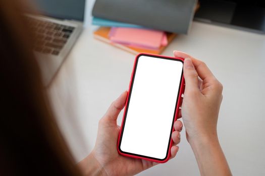 mock up phone in woman hand showing with blank copy space screen for your text message or information content, female reading text message on cell telephone