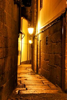 Beautiful streets and old stone facades of the portuguese medieval village of Guimaraes at night