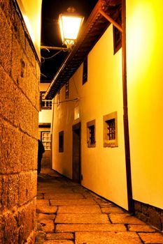 Beautiful streets and old stone facades of the portuguese medieval village of Guimaraes at night