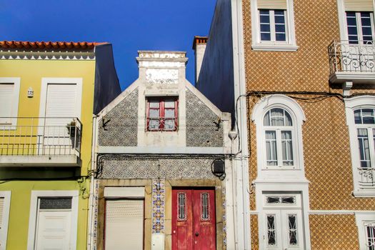 Beautiful and old colorful typical facades next to the water canal in Aveiro village in January