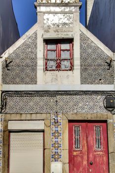 Beautiful and old colorful typical facades next to the water canal in Aveiro village in January