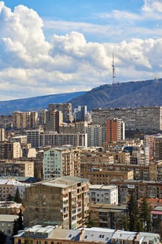 Panorama of a densely populated city. Tbilisi city landscape from above.