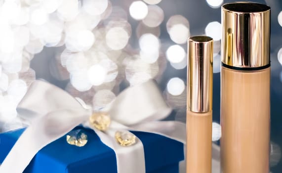 Cosmetic branding, Christmas glitter and girly blog concept - Holiday make-up foundation base, concealer and blue gift box, luxury cosmetics present and blank label products for beauty brand design