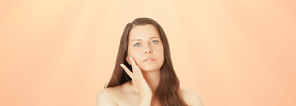 Sunny face portrait of young woman, suntan skin tone and beauty cosmetics. Beautiful brunette female model with natural tan using sunscreen product.