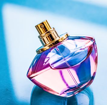 Perfume bottle on glossy background, sweet floral scent, glamour fragrance and eau de parfum as holiday gift and luxury beauty cosmetics brand design.