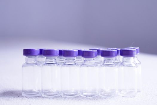 Empty glass jars of coronavirus vaccines. No people
