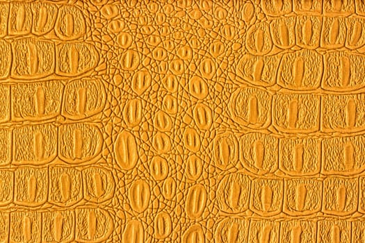 Orange crocodile leather texture. Abstract background for design.