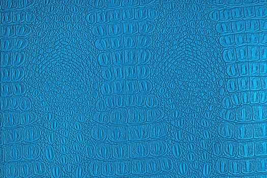 Blue crocodile leather texture. Abstract background for design.