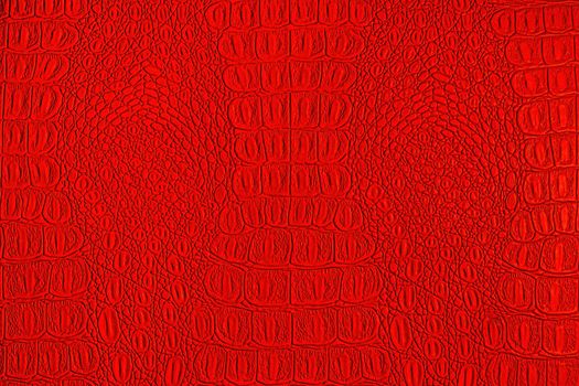 Red crocodile leather texture. Abstract background for design.