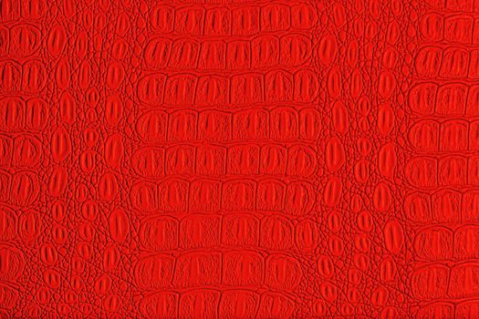 Red crocodile leather texture. Abstract background for design.