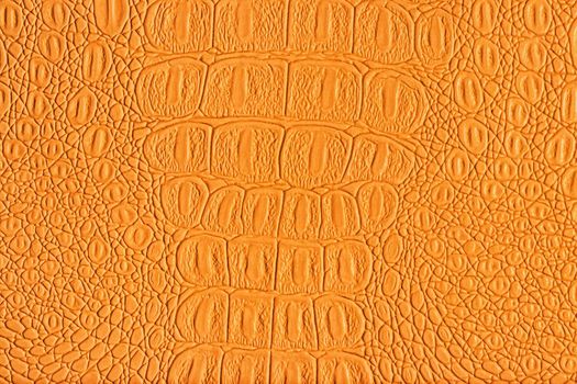 Orange crocodile leather texture. Abstract background for design.