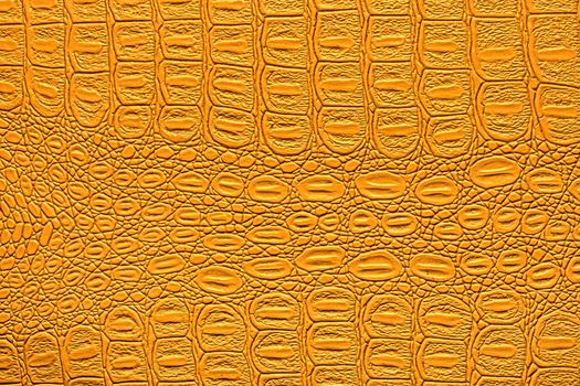 Orange crocodile leather texture. Abstract background for design.