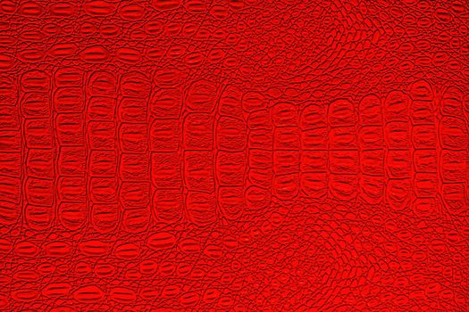 Red crocodile leather texture. Abstract background for design.