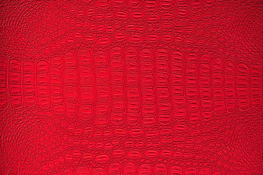 Red crocodile leather texture. Abstract background for design.