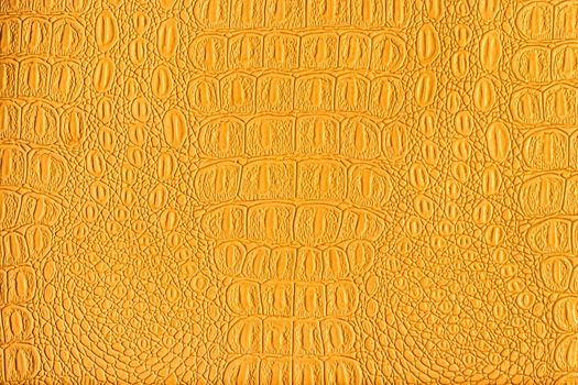 Orange crocodile leather texture. Abstract background for design.