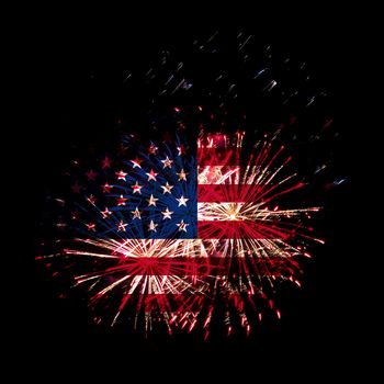 Concept of celebrating Independence Day in United States of America. USA national flag with fireworks background for 4th of July.