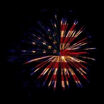 Concept of celebrating Independence Day in United States of America. USA national flag with fireworks background for 4th of July.