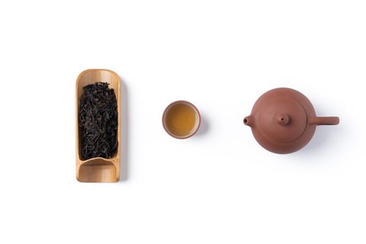 Top view of fresh black tea with kettle teapot and leaves in Taiwan, Asian culture design concept layout.