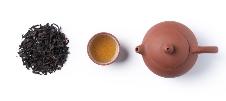Top view of fresh black tea with kettle teapot and leaves in Taiwan, Asian culture design concept layout.