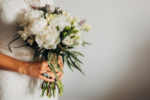 Wedding bouquet in hands of the bride. Wedding in Montenegro