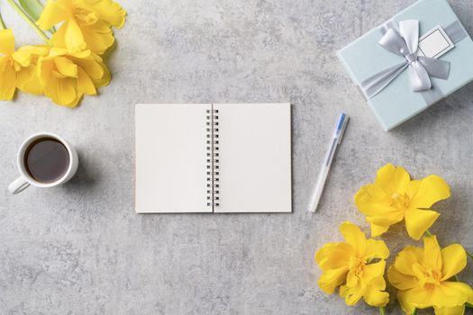 Concept of Mother's day holiday gift idea greeting design with yellow tulip flower bouquet on gray background